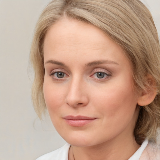 Neutral white young-adult female with medium  brown hair and blue eyes