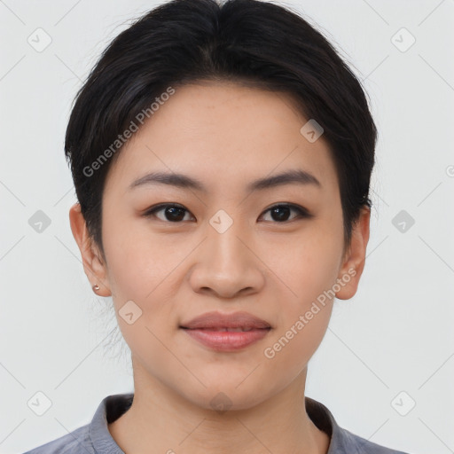 Joyful asian young-adult female with short  black hair and brown eyes