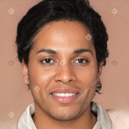 Joyful black young-adult male with short  brown hair and brown eyes