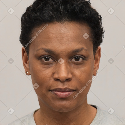 Joyful black adult female with short  black hair and brown eyes