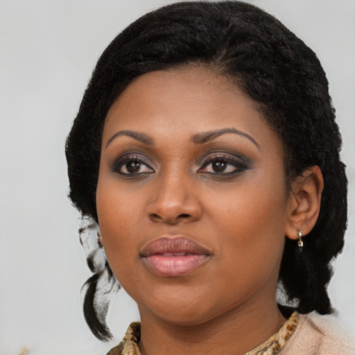 Joyful black young-adult female with medium  black hair and brown eyes