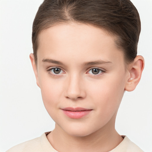 Joyful white child female with short  brown hair and brown eyes