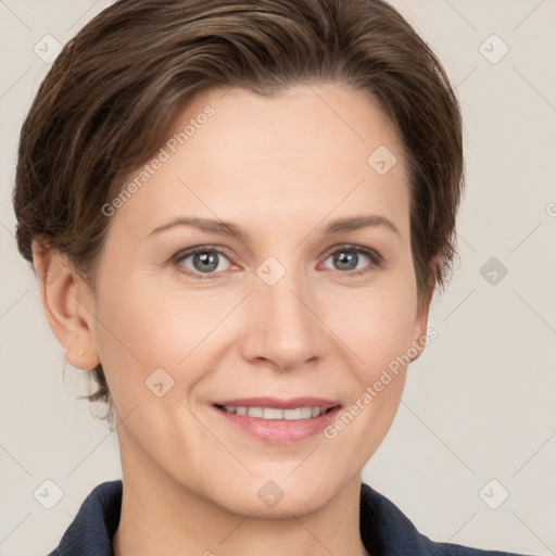 Joyful white adult female with short  brown hair and grey eyes