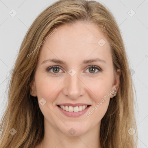 Joyful white young-adult female with long  brown hair and green eyes