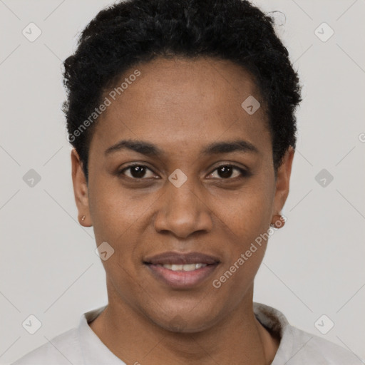 Joyful black young-adult female with short  black hair and brown eyes