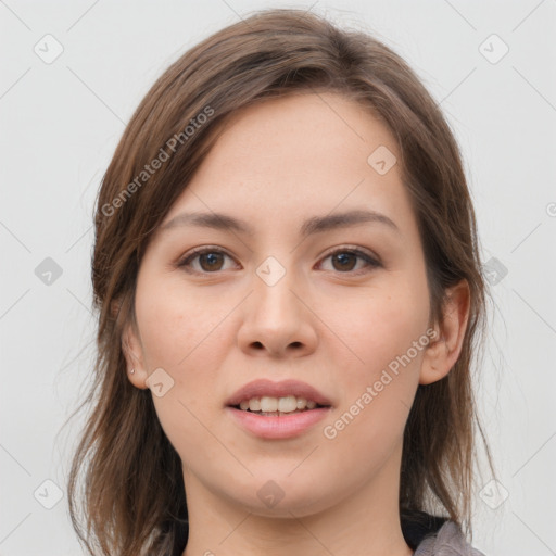 Joyful white young-adult female with medium  brown hair and grey eyes