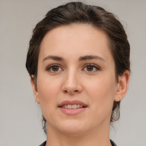 Joyful white young-adult female with medium  brown hair and brown eyes