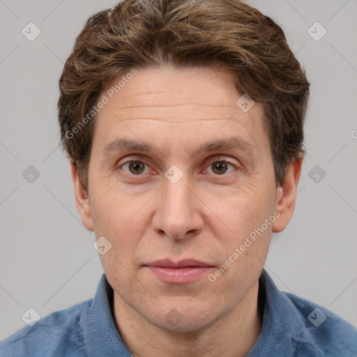 Joyful white adult male with short  brown hair and grey eyes