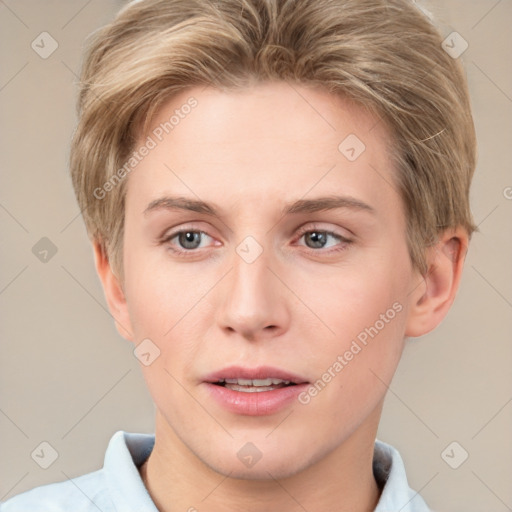 Joyful white young-adult female with short  brown hair and grey eyes