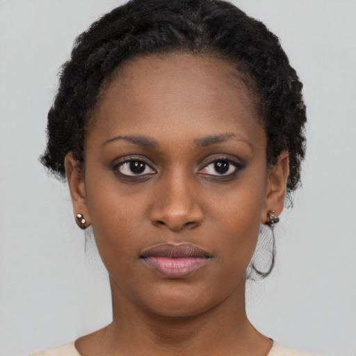 Neutral black young-adult female with short  brown hair and brown eyes