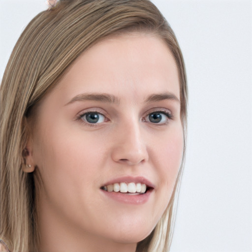 Joyful white young-adult female with long  brown hair and blue eyes