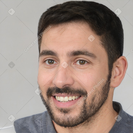 Joyful white young-adult male with short  black hair and brown eyes