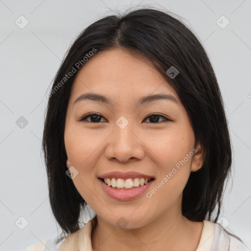 Joyful latino young-adult female with medium  brown hair and brown eyes