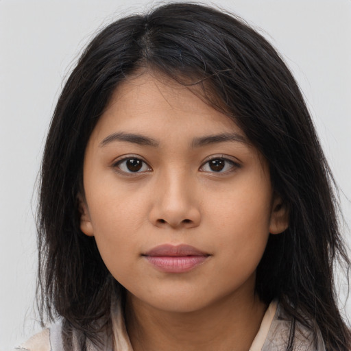 Neutral latino young-adult female with long  brown hair and brown eyes