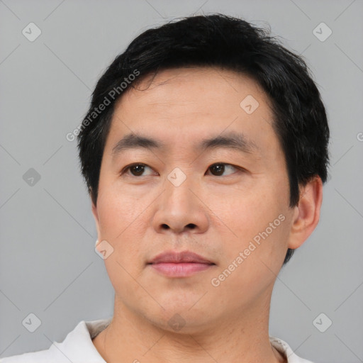 Neutral asian young-adult male with short  black hair and brown eyes