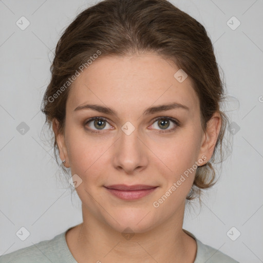 Joyful white young-adult female with medium  brown hair and green eyes