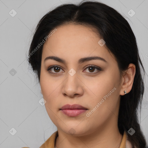 Joyful latino young-adult female with long  brown hair and brown eyes