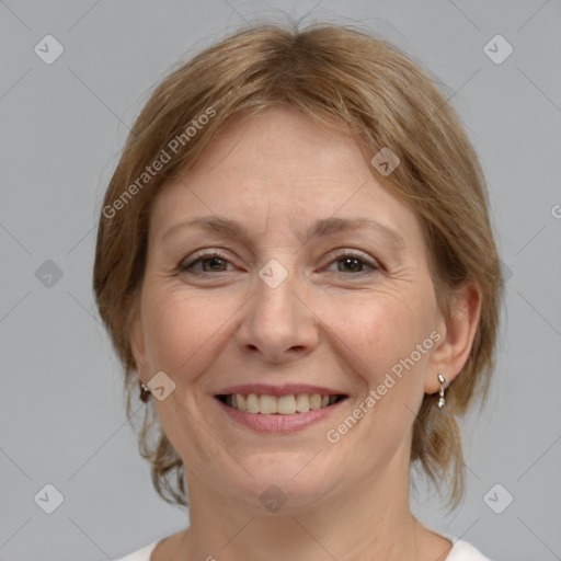 Joyful white adult female with medium  brown hair and grey eyes