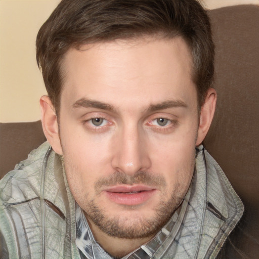 Joyful white adult male with short  brown hair and grey eyes