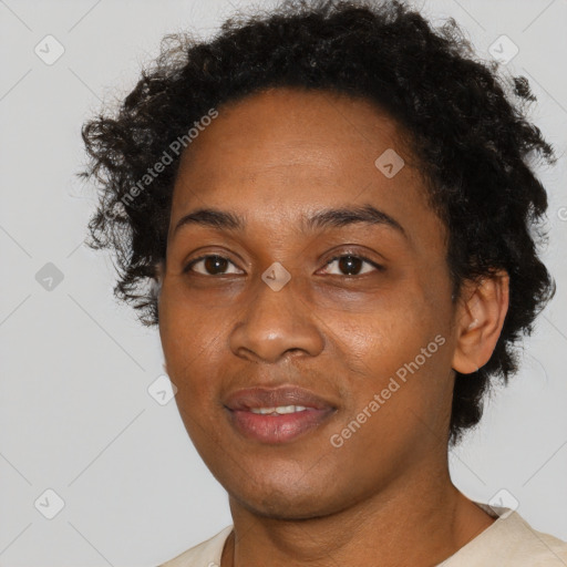 Joyful black young-adult female with short  brown hair and brown eyes