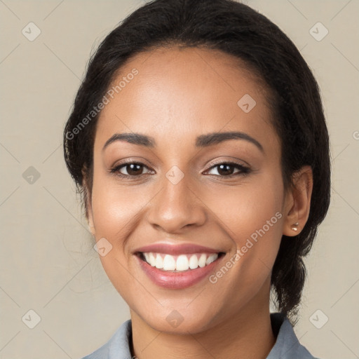 Joyful latino young-adult female with medium  brown hair and brown eyes