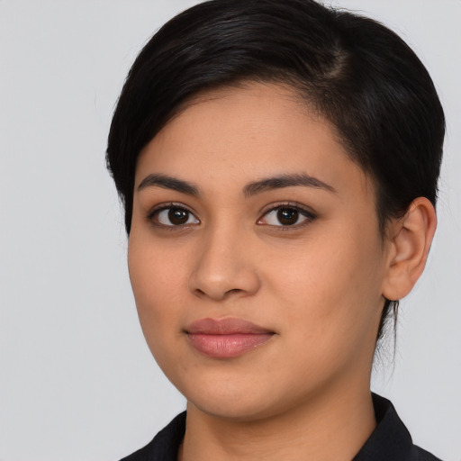 Joyful latino young-adult female with medium  black hair and brown eyes