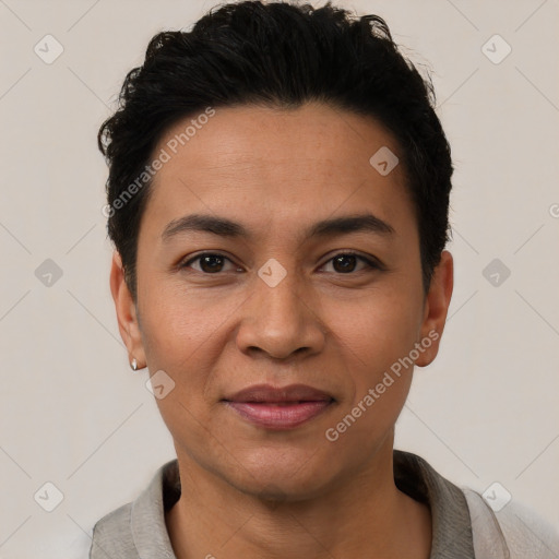 Joyful latino young-adult female with short  black hair and brown eyes