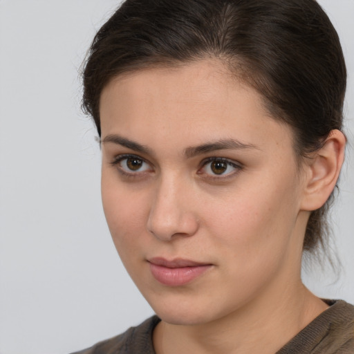 Neutral white young-adult female with medium  brown hair and brown eyes