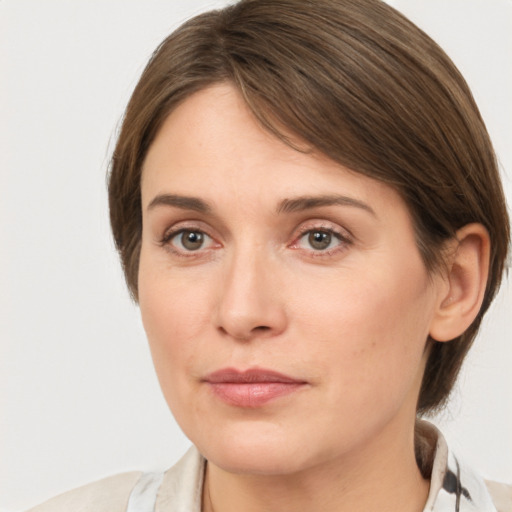 Neutral white young-adult female with medium  brown hair and grey eyes