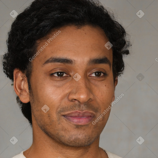 Joyful latino young-adult male with short  brown hair and brown eyes