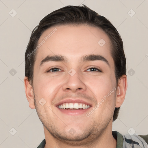 Joyful white young-adult male with short  black hair and brown eyes