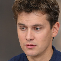 Neutral white adult male with short  brown hair and brown eyes