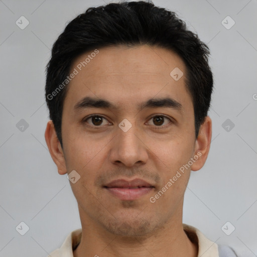 Joyful latino young-adult male with short  black hair and brown eyes