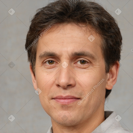 Joyful white adult male with short  brown hair and brown eyes