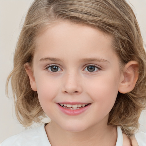 Joyful white child female with medium  brown hair and brown eyes