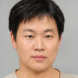 Neutral asian young-adult male with short  brown hair and brown eyes