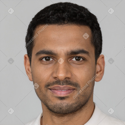 Joyful latino young-adult male with short  black hair and brown eyes