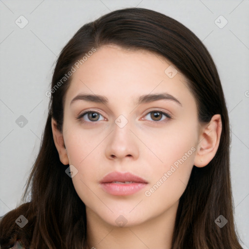 Neutral white young-adult female with long  brown hair and brown eyes