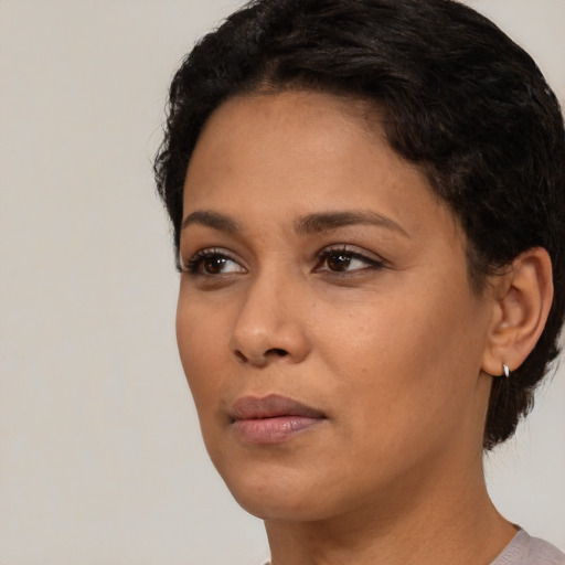 Neutral black young-adult female with short  brown hair and brown eyes