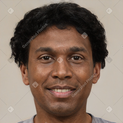 Joyful latino young-adult male with short  brown hair and brown eyes