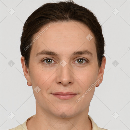 Joyful white young-adult female with short  brown hair and grey eyes