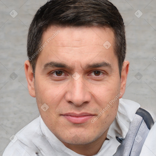 Joyful white adult male with short  brown hair and brown eyes