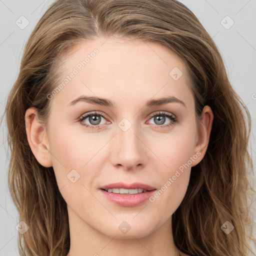 Joyful white young-adult female with long  brown hair and blue eyes