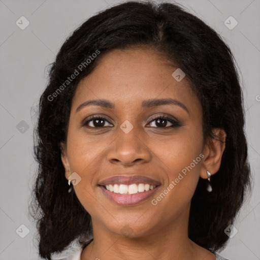 Joyful black young-adult female with medium  brown hair and brown eyes