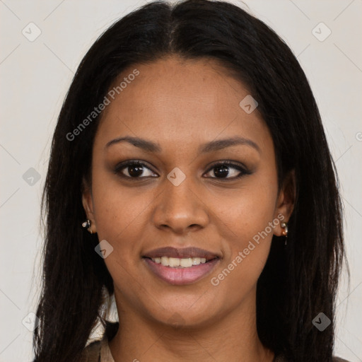 Joyful black young-adult female with long  brown hair and brown eyes