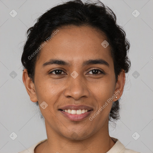 Joyful latino young-adult male with short  brown hair and brown eyes