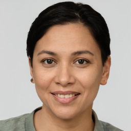 Joyful white adult female with short  brown hair and brown eyes