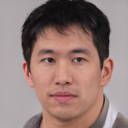 Neutral asian young-adult male with short  brown hair and brown eyes