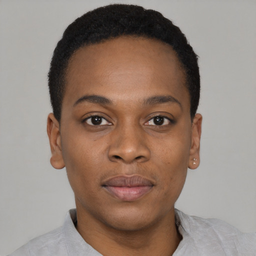 Joyful black young-adult male with short  black hair and brown eyes