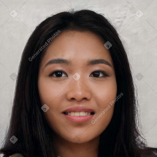 Joyful latino young-adult female with long  black hair and brown eyes